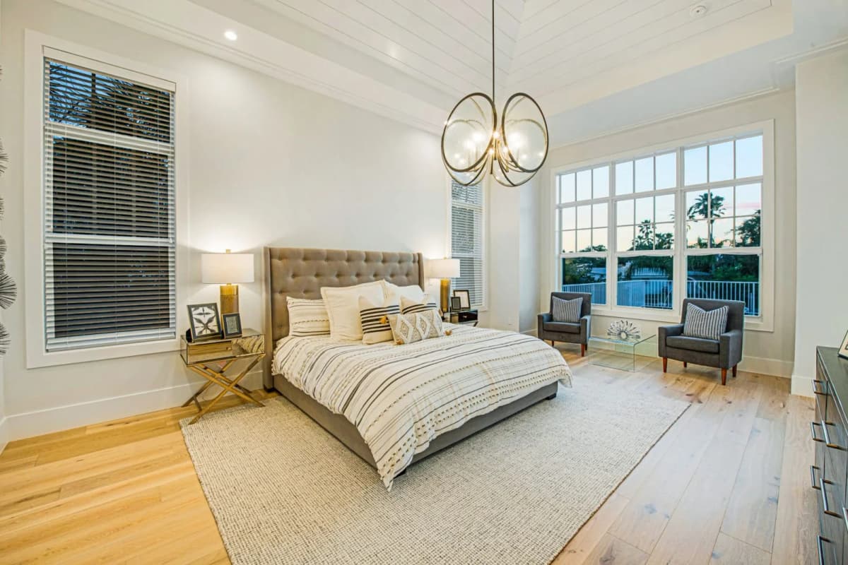 Primary bedroom with chandelier