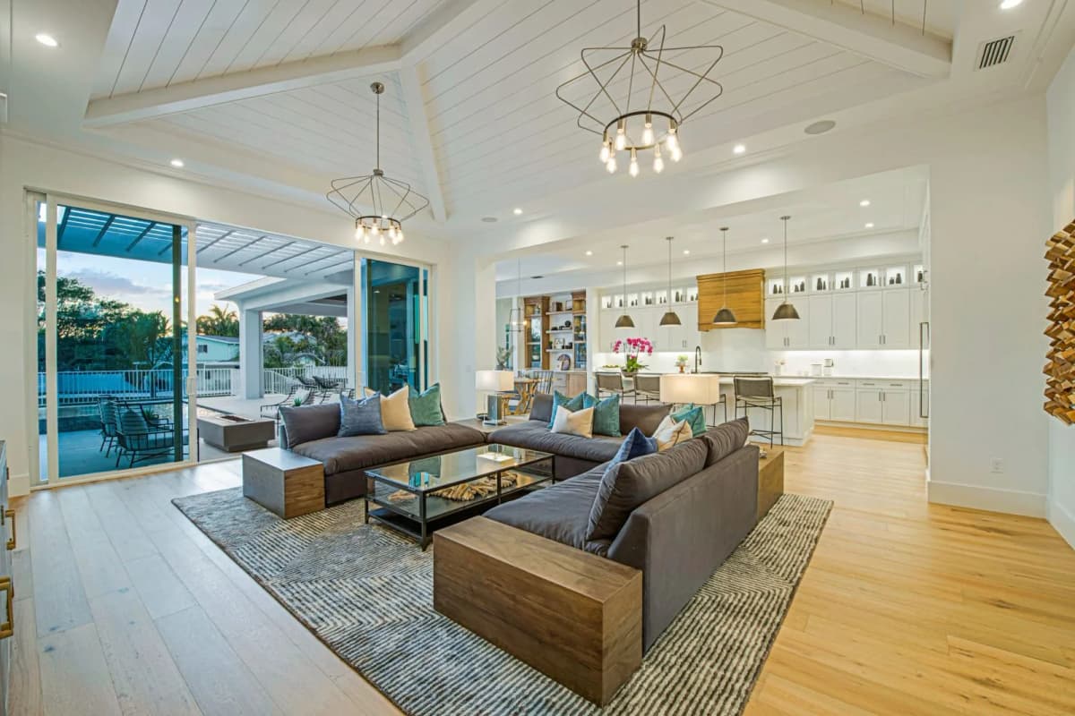 Vaulted great room with pool views