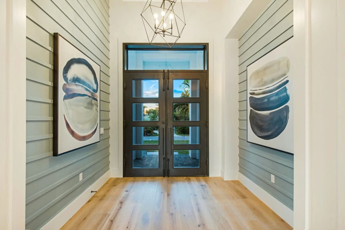 Entry foyer with handcrafted iron doors