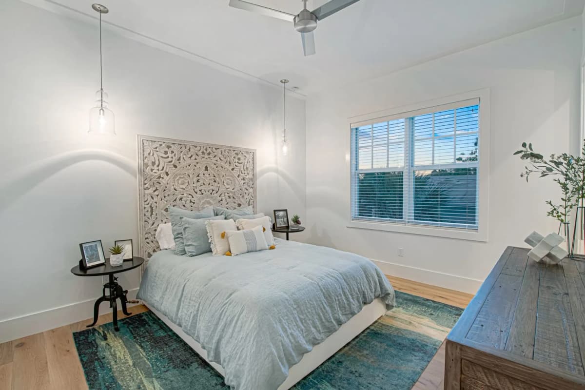 Guest bedroom with carved headboard