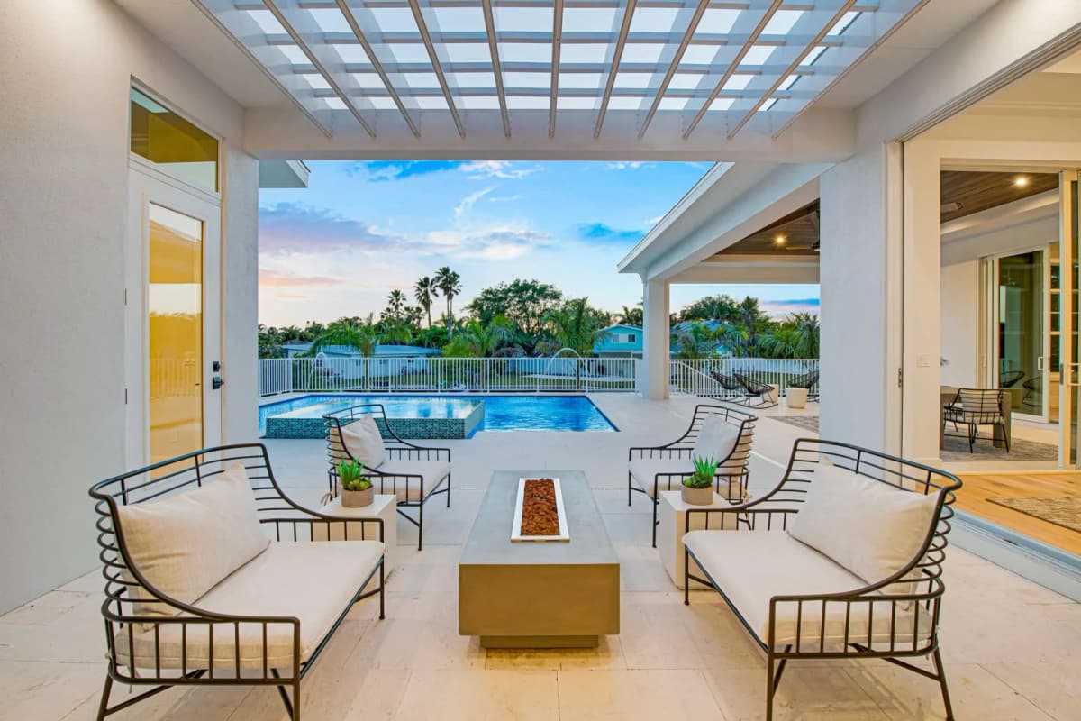 Lanai lounge at dusk overlooking the pool