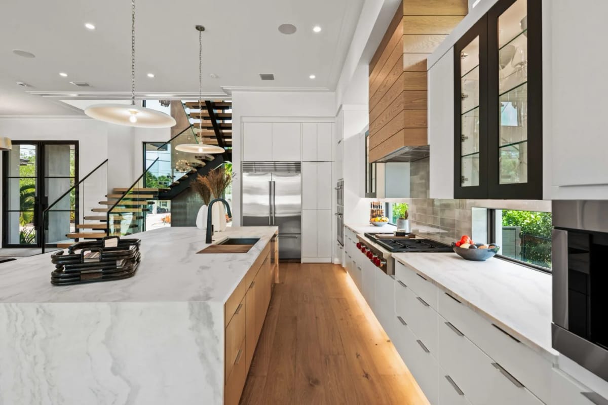 Chef's kitchen with marble waterfall island
