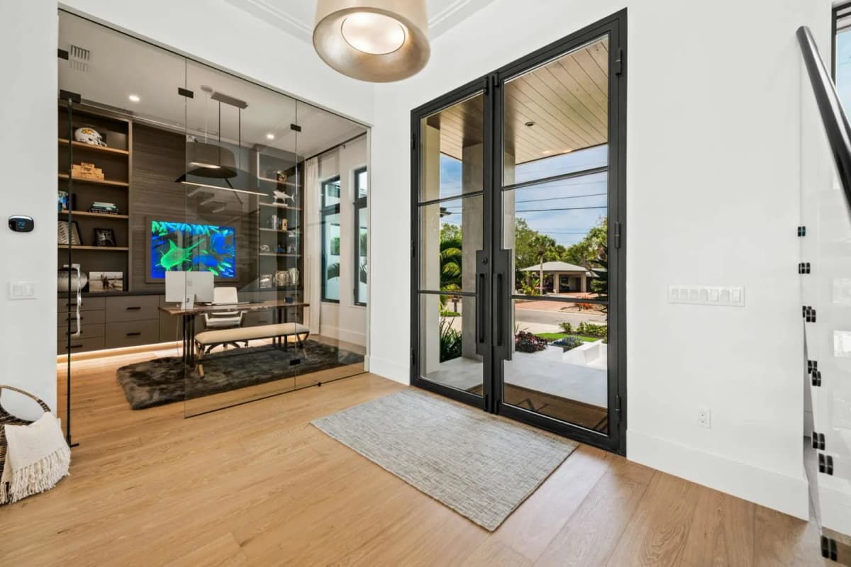 The Marlin entry foyer with glass doors and custom wine display