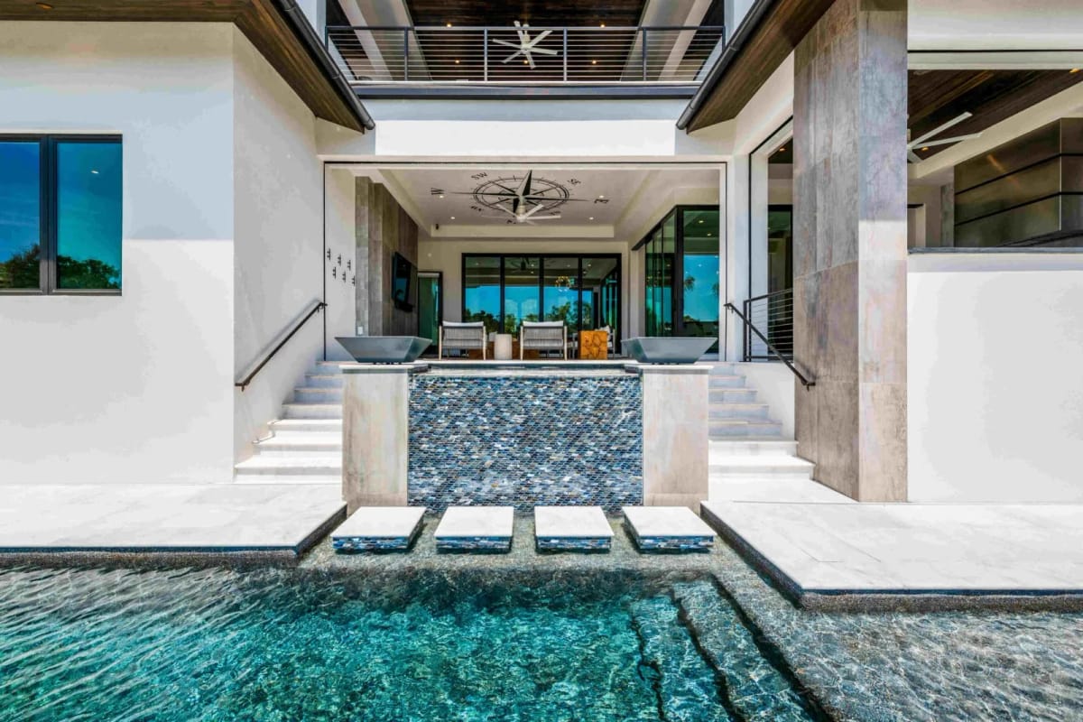 Pool with sun shelf and lanai views