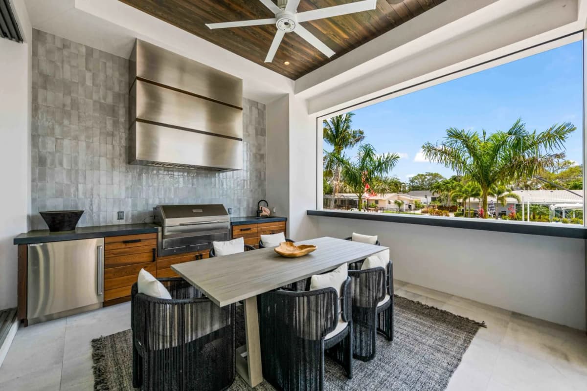 Outdoor kitchen and dining under the lanai