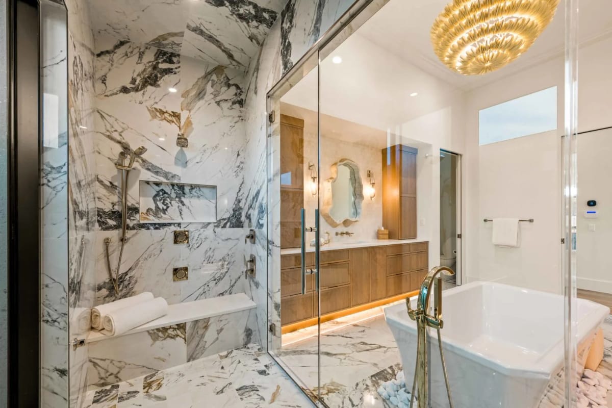 Spa-like primary bath with marble walk-in shower