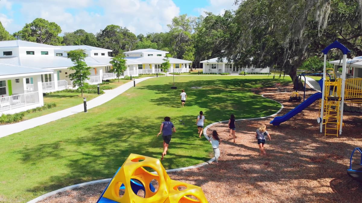 Children playing on the finished Campus of Hope & Healing