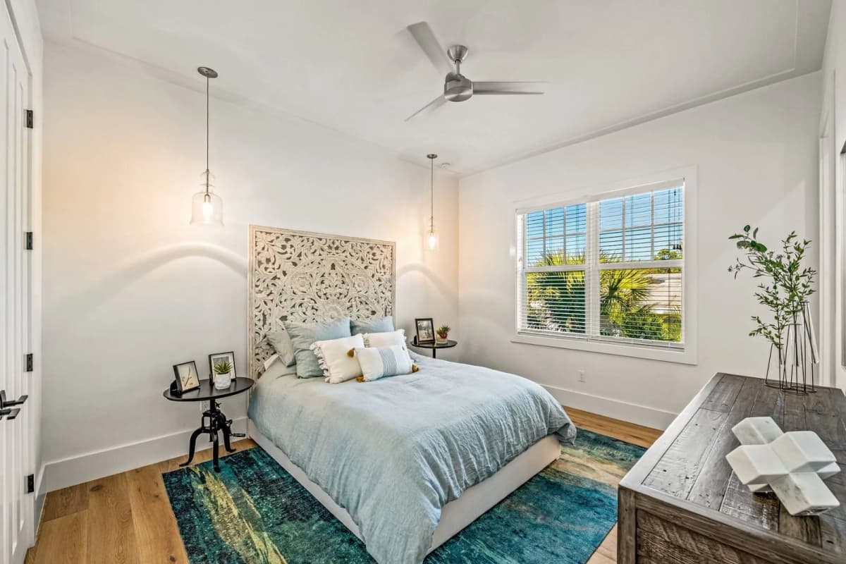 Guest bedroom with blue rug