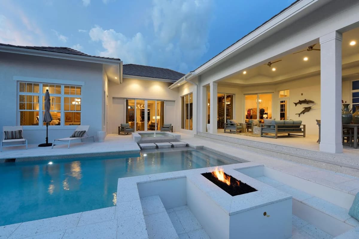 Pool and sunken fire pit at dusk