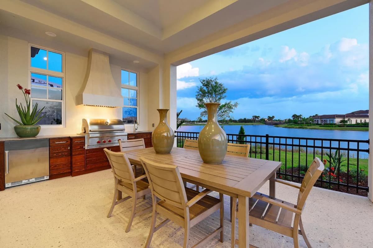 Outdoor kitchen and dining overlooking the water